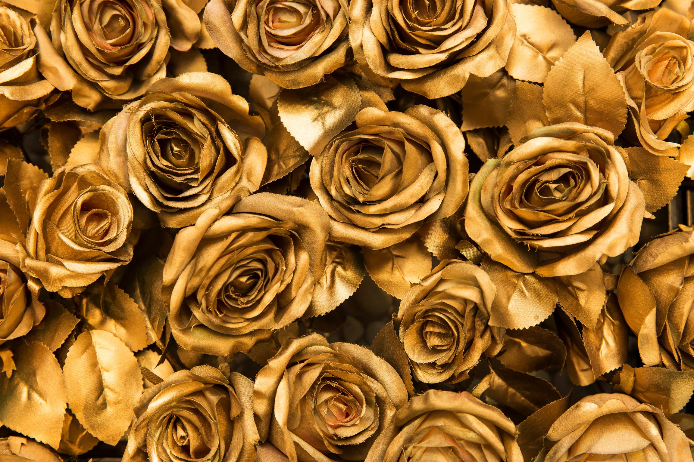 Golden fabric roses background